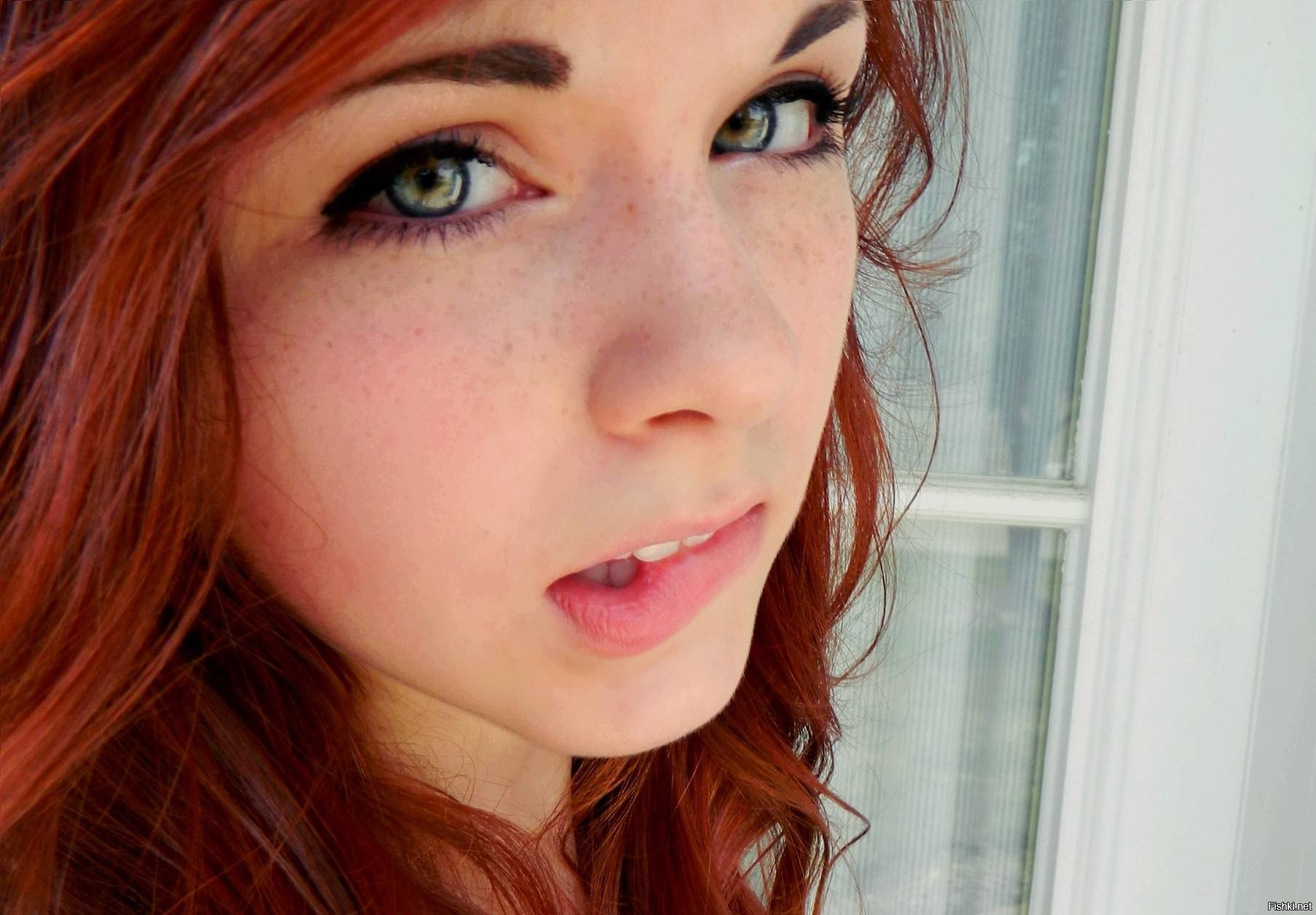 Pretty eyed redhead gives eager