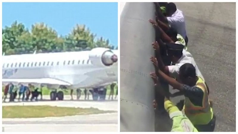 Видео: 20 мужчин вручную толкают 35-тонный самолет