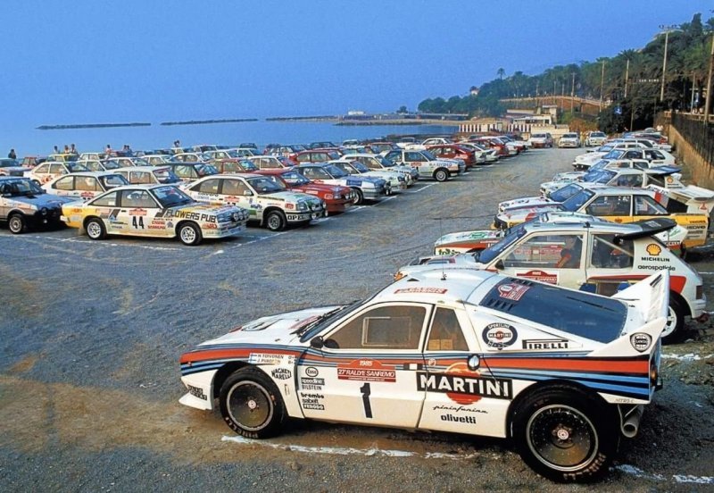 Закрытый парк «Ралли Сан-Ремо» ’85. На переднем плане заводская Lancia Rallye 037 E2, за ней Peugeot 205 T16, 037-я команды Jolly Club и Audi Quattro S1.