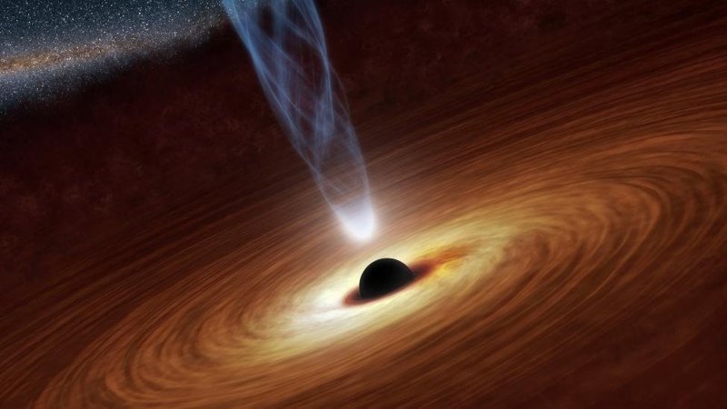  Супермассивная черная дыра, чья масса превышает массу Солнца в миллионы миллиардов раз. Диск вокруг центра состоит из пыли и газа, "спылесошенных" со всей галактики благодаря силе притяжения дыры 