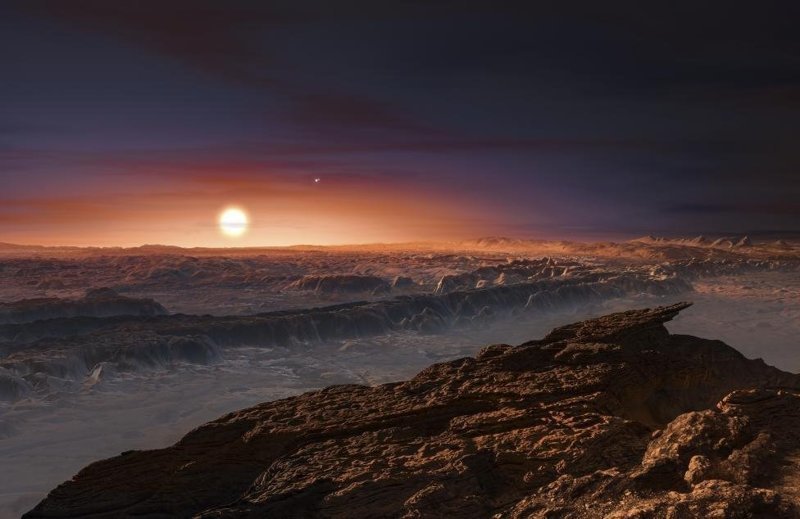  Вид на поверхность планеты Проксима, вращающейся вокруг красного карлика Проксима Центавра, ближайшей к Солнечной системе звезды