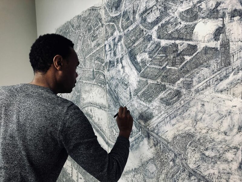 Художник рисует детальные карты городов с высоты птичьего полета
