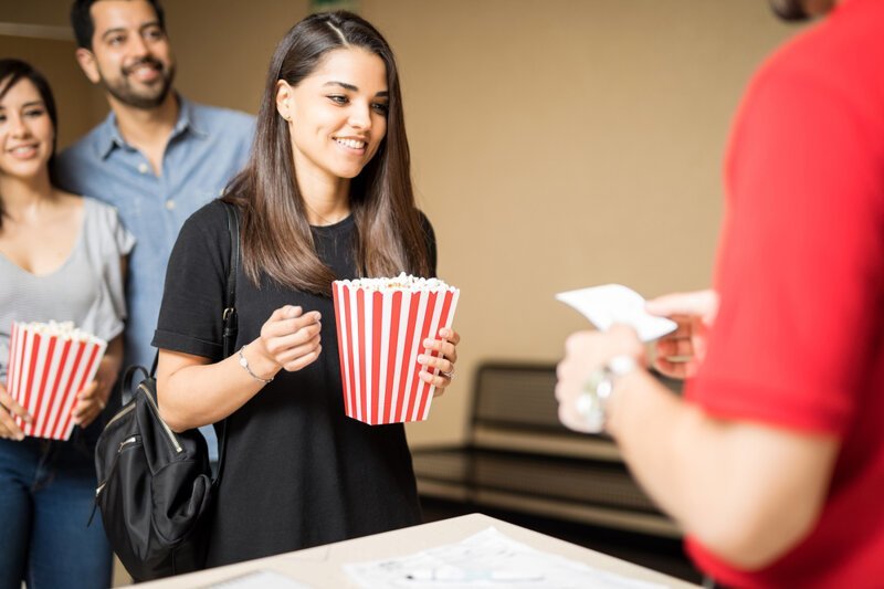 Buying tickets to the cinema. Cinema Employeers.