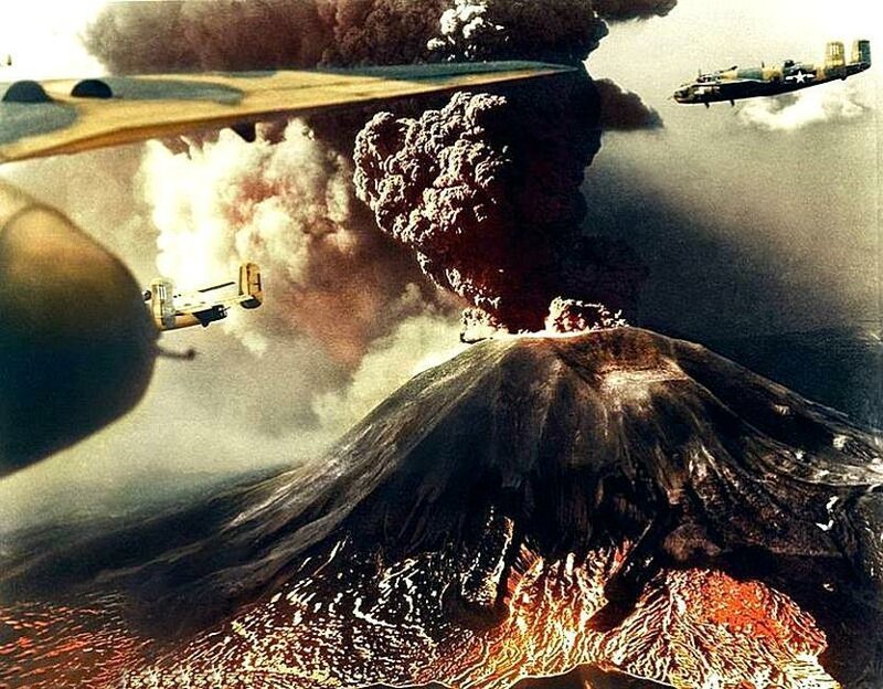 Американские бомбардировщики B-25 летят над вулканом Везувий в Италии, когда он извергается в марте 1944 года во время итальянской кампании Второй мировой войны.