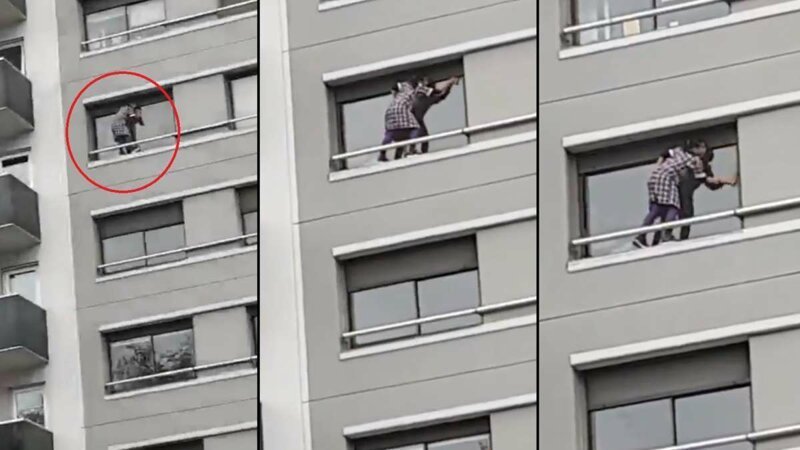 Домработница вылезла за пределы квартиры многоэтажного дома, чтобы помыть окна