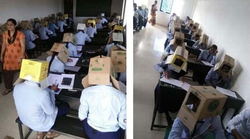 В индийской школе, во избежании списывания, детей заставили сидеть за партами с картонными коробками на головах