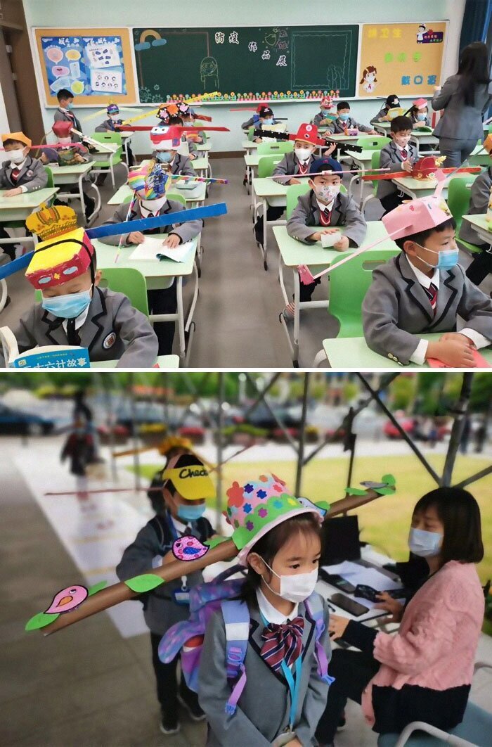 Китайские школьники в специальных метровых шляпах для социальной дистанции