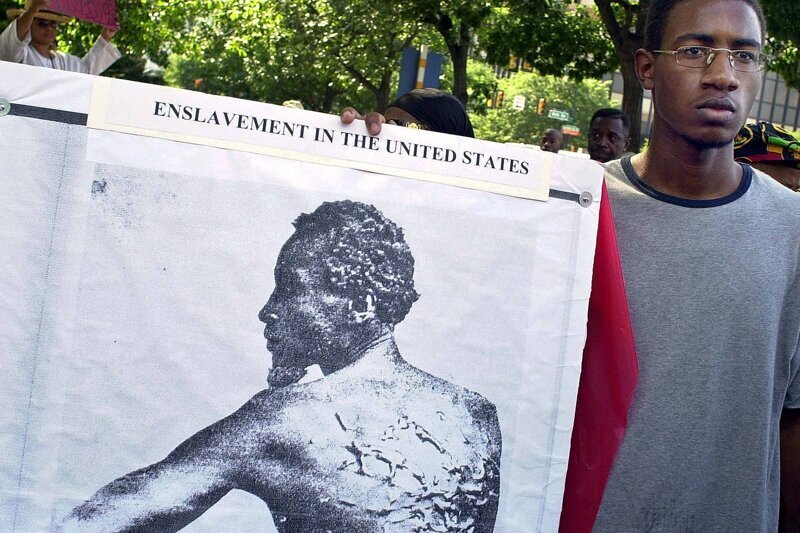 Демонстрация "Месть за предков", освещающая историю рабства чернокожих в США, Филадельфия, 3 июля 2002 года