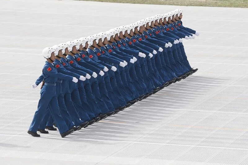 Китайские пилоты в Пекине. (Ng Han Guan / AP)