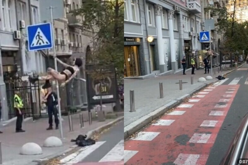 В Киеве девушка забралась на дорожный знак и станцевала для полицейских