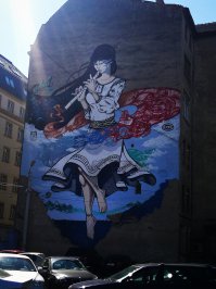 Прям как с граффити сошла :) На одном из домов румынского города Тимишоара.