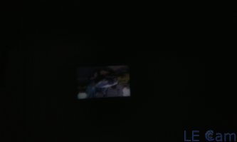 Не фейк. Сначала сам проверь, а потом говори. 
Вот, за пару минут, из подручных материалов. 
Даже без корпуса, что хуже, т.к. засветка помещения сильная. И немного не в фокусе. 

"Проектор" - НТС Инкредибл-С. 
Снимал на Флай 4403, а та та еще камера. :)