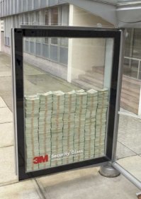 Надо было просверлить сбоку в раме дырку, закачать туда Газ из балона, поджечь запал. Взрыв изнутри разобьёт стёкла.
Так Банкоматы взрывают же !