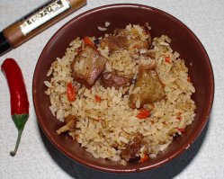 А это рисовая каша с деревенским скаковым петухом