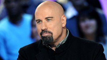 нафига он только этот парик носит... быть лысым ему вполне идет