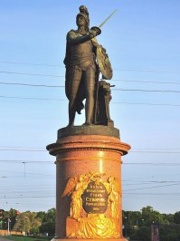 Из военного похода граф Суворов возвращается с победой. По такому случаю Павел I приказал возвести в Гатчине памятник полководцу. Впервые в русской истории решено было поставить памятник при жизни героя.

В 1799 году был принят проект скульптора Михаила Ивановича Козловского. В разработке проекта также участвовал А. Н. Воронихин. Уникален памятник тем, что он стал первым крупным монументом полностью созданным русскими мастерами. Отлил скульптуру литейщик Василий Екимов который по договору от 12 октября 1800 года обязывался отлить и отшлифовать статую к 1 апреля 1801 года. Но вышла задержка из-за большой загруженности литейной мастерской. В то же самое время там отливали ворота для Михайловского замка, статуи, чаши и вазы для Большого каскада в Петергофе. Бронзовый барельеф на пьедестале выполнил скульптор Ф. Г. Гордеев.

Во время проектирования планируемое место расположения памятника было изменено. Павел I захотел видеть его у своей новой резиденции - Михайловского замка. Для изготовления пьедестала использовался материал, оставшийся от строительства Исаакиевского собора: "тивдийский" (олонецкий) светло-красный полированный порфир. Ступени к пьедесталу выполнены из сердобольского дикого камня с мызы Келла. Козловский несколько раз жаловался на недобросовестность подрядчиков, выполнявших пьедестал. То он был грязным и не в нужных скульптору пропорциях, то установлен "косо и на один бок".

Прижизненным памятник так и не стал. За год до открытия граф Суворов скончался. Не увидел открытия памятника и сам император, в Михайловском замке за два месяца до открытия монумента он был убит. Памятник А. С. Суворову был открыт 5 мая 1801 года на Марсовом поле у берега Мойки. На церемонии присутствовал новый император Александр I.

Скульптор Козловский изобразил Суворова в образе бога войны Марса, который щитом с гербом Российской Империи прикрывает жертвенник с коронами неаполитанских и сардинских королей и тиарой папы римского.

В 1818 году по предложению архитектора К. Росси монумент перенесли в центр только что созданной Суворовской площади. В 1834 году постамент из блоков мрамора вишнёвого цвета пострадал из-за сильных морозов. Его заменили на постамент из розового гранита.

Во время блокады Ленинграда памятник планировали спрятать, один из вариантов предполагал его перемещение в подвал соседнего дома. Однако сделать это так и не удалось. Между тем в один из блокадных дней артиллерийский снаряд пролетел рядом с монументом и влетел как раз в тот подвал где мог быть памятник. За всё военное время памятник Суворову не пострадал.
