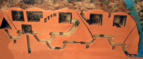 Боевики через тайные ходы проникают на позиции ВСУ в Широкино, - военные

В поселок Широкино диверсионные группы и снайперы проникают через подкопы. Ведут короткие обстрелы и быстро исчезают. Об этом рассказывают украинские военные. Бойцы говорят: за время пребывания в поселке боевики оборудовали целую систему окопов и снайперских укрытий. Следы их присутствия повсюду: в наспех брошенном оружии, одежде, сгоревшем транспорте и заминированных домах, пишет Радио Свобода. 

В приморском поселке Широкино не осталось ни одного целого дома. Жители покинули свое жилье с началом военных действий. Сейчас центральная улица Широкино – единственное место, по которому можно передвигаться без угрозы подорваться на мине или растяжке. Совсем недавно она обстреливалась снайперами.

За время пребывания в поселке боевики соорудили множество потайных ходов, соединяющих по несколько частных домов. После отхода эти сооружения до сих пор используют для проникновения на территорию поселка диверсионные группы и снайперы, говорят украинские бойцы.

«У них такие огневые позиции. Они тут по всему селу, по всем улицам. Иногда боевые действия с этой позиции идут 30 секунд. И вот вы видите, подкопы идут во двор, а из двора бой идет буквально еще минуту. Тут подкопы по всему селу. Заходят через подкопы и вылазят как грибы, не пойми откуда. Тут по уму все сделано. Как шахтеры учили, так они все и делают», – сказал военнослужащий Эдуард.