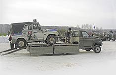 УАЗ-2360L (трехосный) он же Транспортёр спортивных джипов.
Грузовик построен на основе УАЗ-2360 (4х4) но есть несколько существенных отличий от базовой модели. 
Прочность несущей рамы удлиненной конструкции заметно усилена. 
Спереди неразрезная балка ведущего моста опирается на пружины, которые дополнены амортизаторами и стабилизатором поперечной устойчивости, зависимая подвеска второго и третьего мостов снабжена четырьмя полуэллиптическими рессорами. Конструкция всех мостов с неразъемными картерами типа «Спайсер». 
Место прежнего мотора занял V-образный бензиновый восьмицилиндровый двигатель ЗМЗ-5234 рабочим объемом 4,67 л. Мощность силовой установки 130 л.с. и внушительный крутящий момент, достигающий 317 Н·м, позволяют уверенно перевозить груз массой 2,5 т как по дорогам с твердым покрытием, так и по пересеченной местности. 
На высоте оказались и динамические качества: максимальная скорость автомобиля достигает 110 км/ч. Двигатель работает в одном блоке с однодисковым сцеплением, снабженным гидроприводом и механической 5-ступенчатой полностью синхронизированной коробкой передач. Крутящий момент к ведущим колесам передается с помощью двухступенчатой раздаточной коробки. Во время движения по шоссе первый и третий ведущий мосты могут отключаться. В распоряжении водителя рулевое колесо с травмобезопасной колонкой и гидроусислитель. 
За надежность остановки отвечают дисковые механизмы на передних и барабанные на задних колесах, все с гидравлическим приводом. Кабина рассчитана на два человека. Собственная масса автомобиля не превышает 2,8 т, а длина внедорожника составляет 6650 мм. Установка в передней части кузова электрической лебедки с дистанционным управлением позволяет превратить машину в эвакуатор автотехники. Не случайно заводская команда по автокроссу в классе Т1, где соревнуются «джипы» марки УАЗ-3151 (УАЗ-469), использует УАЗ-2360L для транспортировки спортивных автомобилей к месту соревнований и обратно.