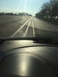 Крым, делают новый въезд в аэропорт под Симферополем. На самом деле разметку замазали серой краской, но на солнце бликует намного хуже чем на фото. Если не местный и не знаешь по какой полосе ехать, то наткнешся на островок безопасности, а там еще и знак обгон запрещен и частенько ГАИ стоит.....