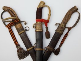 А я занимаюсь русским наградным холодным оружием.