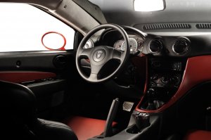 Тагаз А́квилла. Российский серийный авто. Был. С кузовом который не гниет и мотором, который не ломается. (Правда и не едет, но это традиция).
Великолепная машина за свою цену (350-450к вроде шла). И ее, я по крайней мере, обсирать точно не буду.