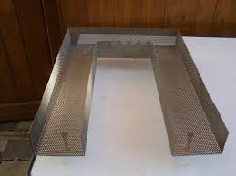 для начала выбрось топку в топку. во первых оцинковка: надо долго отжигать, что бы весь цинк ушел...иначе потравишь всех, замени обычным дымогенератором. Вот как вариант.

Во вторых, оцинковка внутри тоже не есть гуд. Если нет возможности убрать, покрась ее что ли...или еще что.... 

в третьих сетка и мешковина тоже лишние, потому как при холодном копчении ничего не капает. 

И да, щепу вымачивать не надо (если конечно используется дымогенератор, а не печка буржуйка).