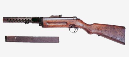 Пистолет - пулемёт МР-28 (шмайссер)

ТТХ пистолет-пулемёта МР-28 : калибр - 9 мм, начальная скорость пули - 340 м/с, длина - 810 мм, масса - 4,7 кг,
емкость магазина - 32 патрона, тем стрельбы - 600 выстрелов/минуту, практическая скорострельност - 250 в/м, прицельная дальность - 200 м.

В отличие от модели MP-18.I, у которой питание патронами производилось из дискового магазина емкостью 32 патрона, в модели MP-28.II используется более удобный и простой в производстве коробчатый магазин такой же емкости, патроны в котором располагаются в два ряда в шахматном порядке. На задней стенке коробки магазина имеются прямоугольные щели с цифрами 8, 16, 24, 32, указывающими число остающихся патронов в магазине. Магазин вставляется в приемник, расположенный с левой стороны пистолета-пулемета. Пистолет-пулемет имел секторный прицел, состоящий из прицельной планки с пружиной, хомутика, защелки хомутика с пружиной и оси прицельной планки. На наружной стороне прицельной планки нанесены деления от 1 до 10, каждое деление соответствует изменению дальности на 50 м. Пистолет-пулемет MP-28.II был выпущен малой серией, так как использование его экипажами бронемашин оказалось затруднено из-за наличия жесткого деревянного приклада.(с)