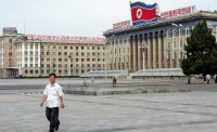 Больше похоже на: Минск, Октябрьская площадь, Дворец Республики. 5й год, как Президент разрешил 150 000 китайцев работать в "Парке "высоких" технологий" о_0