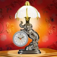 Тогда уже слона.И не с лампой,а с прожектором