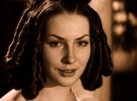 Наталья Данилова. Недавно посмотрел "Маленькие трагедии" и был очарован ее красотой. Также играла в "Место встречи изменить нельзя".