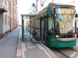 Хороший трамвай, но есть нюансы.

1. Низкая ступенька, комфортная для заезда детских колясок, будет в ровень с полом только если в городе все остановки будут пандусные, как в Европе - то есть сама остановка будет "островком-платформой" 20 см в высоту. Иначе смысла нет. 
2. Фотка с тётей, приставляющей к трамваю пандус просто убила! Это будет делать сам инвалид или такая же тётя? А люди будут терпиливо ждать? Ага, охотно верю, особенно в час пик. Впрочем эта проблема решится автоматически вместе с первой. Я был свидетелем в СПб как для выезда подобной нелепицы в автобусе нужно было что-то там повернуть, система не работала, сам водитель возился - всё безуспешно, вынесли коляску на руках. Это я к тому, что вместо придумывания не всегда надежной автоматики, следует продумывать геометрию и инфраструктуру пассажирских перевозок. 
Но за старания плюс!