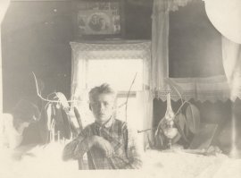 Учился читать и писать под ней.