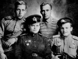 Немного добавлю:
Вскоре после того, как ей исполнилось 17 лет, началась Великая Отечественная война.
25 июля 1941 года бои начались в её родном городе. Немцами был высажен десант. Она под бомбёжкой перевязывала раненых бойцов и командиров. Когда 96-й кавалерийский полк 5-й кавалерийской дивизии 2-го кавалерийского корпуса стал отступать, она уговорила командира полка взять её с собой, сказав, что ей скоро 18 лет.
13 августа 1941 года немецкие войска приблизились к Новому Бугу. Их наступление сдерживали части 169-й стрелковой дивизии 18-й армии. Ночью советские части по приказу командования оставили Новый Буг, и 14 августа 1941 года немцы заняли родное село Е. Н. Завалий.
В полку она служила санитаркой. При переправе через Днепр в районе Хортицы была ранена, отправлена в Краснодар в госпиталь. Медики хотели её комиссовать, но она отказалась. После лечения была направлена в запасно й полк, но когда отбирали солдат на передовую, её приняли за мужчину, тем более что она была в гимнастёрке и галифе, а в документах было записано  Завалий Евдок. Ник. . Она никого разубеждать не стала.