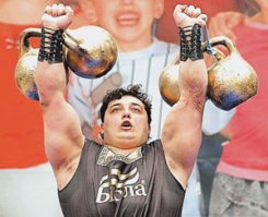 Дмитрий Васильевич Халаджи (род. 19 апреля 1979, Комсомольское, Донецкая область, Украина)   украинский спортсмен, чемпион 1-го чемпионата Украинской бездопинговой федерации пауэрлифтинга в отдельных упражнениях (жим лежа) 2009 г.[3] Внесён в Книгу рекордов Гиннесса как автор шестидесяти трех рекордов.

Рекорды:

   - Поднятие камня весом 152 кг одной рукой (побитие рекорда Бибона). Знаменитому древнегреческому атлету Бибону, жившему в VI веке до н. э., удавалось поднять одной рукой камень, вес которого составлял 143,5 кг. Этот своеобразный снаряд сохранился до наших дней   он покоится в музее города Олимпия. На камне имеется надпись на древнегреческом  Я, Бибон, сумел оторвать этот камень от земли и поднять его одной рукой над головой .
   - Выкручивание двух гирь весом 50,5 и 40,5 кг в одной руке: правой рукой   6 подъёмов за 46 с, левой рукой   8 подъёмов за 49 с (Казань, 2010).[8]
   - Крест с гирями 39,5 и 38,5 кг на мизинцах (Казань, 2010).[8]
   - Завязывание шести двадцатисантиметровых гвоздей за полторы минуты.
    -  Чёртова кузня    Дмитрий был уложен на гвозди, сверху на нём три плиты общим весом 700 кг, которые разбивали кувалдами.
   -  Поднял метр трубы весом 1,022 т и продержал 12,5 с (Донецк).