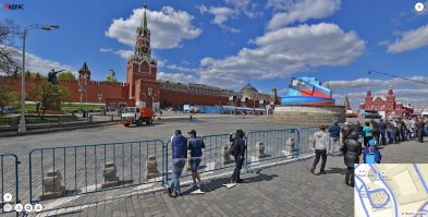 +++ Красная площадь.	
+++ ... Зато нарисовали бетонный параллелепипед, на месте которого в 1964 году
+++ построят гостиницу "Россия" (в настоящий момент гостиница снесена).

Это не то место. На заднем плане - исторический музей. То есть, по идее, точка зрения - между Храмом Василия Блаженного и памятником Минину и Пожарскому. (первая картинка). Гостиница Россия - в этом случае сзади-справа, Исторический музей - как на открытке. А "коробка" нарисована между Спасской и Константино-Еленинской башней. 
Но в целом, географической точности на картинке нет. Судя по ориентации памятника, смотрят на него с Лобного места. В таком случае увидеть Исторический музей никак нельзя. (картинка 2).