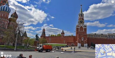 +++ Красная площадь.	
+++ ... Зато нарисовали бетонный параллелепипед, на месте которого в 1964 году
+++ построят гостиницу "Россия" (в настоящий момент гостиница снесена).

Это не то место. На заднем плане - исторический музей. То есть, по идее, точка зрения - между Храмом Василия Блаженного и памятником Минину и Пожарскому. (первая картинка). Гостиница Россия - в этом случае сзади-справа, Исторический музей - как на открытке. А "коробка" нарисована между Спасской и Константино-Еленинской башней. 
Но в целом, географической точности на картинке нет. Судя по ориентации памятника, смотрят на него с Лобного места. В таком случае увидеть Исторический музей никак нельзя. (картинка 2).