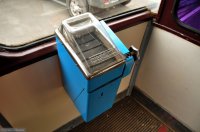 По порядку.
У кассы, показанной на фото не было конвейера, монеты ссыпались в ящик под действием собственного веса, когда набиралось определенное их количество. Конвейерные появились позже  и были гора-аздо компактнее
Далее. Пневмопочта вполне себе современная тема - в новых отделениях того же Сбербанка её вовсю используют .
Далее. Сникерсы и иже с ними появились намного раньше, во второй половине 80х, когда появились т.н. "кооператоры". Помню, один сникерс стоил как чугунный мост и мы покупали один человек на пять вскладчину и резали ножом... Так что судя по фото их как раз не покупают, а смотрят на них как на заморское чудо:) Потом, когда в Ступино построили сникерсную фабрику, цены стали доступными для всех. 
Далее. Про ДНД - нас (студентов) загоняли туда силком (каждый должен был отдежурить хотя бы раз в месяц), естественно, ни о каких отгулах студентам не было и речи. Хотя основное время мы сидели где-нить в теплом месте )) Правда, один раз пришлось дежурить в вытрезвителе (использовали в качестве понятых при описи вещей). Ну а фотка в качестве иллюстрации явно постановочная:).
 Ну и от себя добавлю