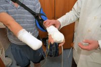 Болгарка сама по себе более чем опасный инструмент.

Любые вариации на подобные темы, если и не являются уголовно наказуемым побуждением к самоубийству, то рассчитаны на слабоумных и отважных.