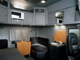 Да никто не спорит, что габариты кабины заводские. Но на картинке интерьер не серийный. Фото серийного салона прилагаю. А на картинке в комментарии салон "кастомный"