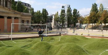 Можно посадить 5-6 деревьев, или кустов, всем двором.
Ну или закопать эти булыжники, и засеять травой, чтобы получилось что то вроде картинки снизу