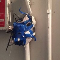 Чё вы докопались?Электрик так видит.Вы только вглядитесь-какие линии!А какая передача оттенков цвета синей изоленты!Рваные детали говорят о глубочайших переживаниях творца,видимо-о неразделенной любви...Открытая коробка символизирует открытую душу художника.Закрытая заглушка в распредкоробке говорит нам о чём-то запретном для него,а вот открытая имеет явно эротический подтекст.