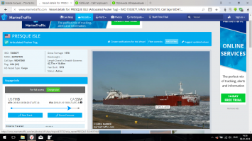 Огромное обледеневшее судно Presque Isle входит в гавань