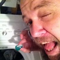 вытащил соплю из стиралки и собирается сожрать.  аж рот заранее открыл