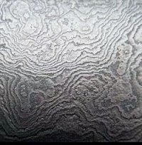 Вот дамаск ("дикий", т.е. без специально созданного рисунка)