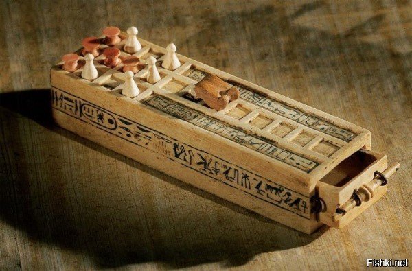 Вот ещё одна занимательная игра: 

Называется "Сенет". Это самая древняя настольная игра, известная человечеству. Наборы для игры в Сенет впервые нашли в некоторых гробницах древнеегипетских фараонов и датируются от 3500 до 2500 лет до н.э.
Настоящих правил никто не знает, но есть их реконструкции. В магазинах можно найти вот такие современные наборы: