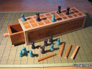Вот ещё одна занимательная игра: 

Называется "Сенет". Это самая древняя настольная игра, известная человечеству. Наборы для игры в Сенет впервые нашли в некоторых гробницах древнеегипетских фараонов и датируются от 3500 до 2500 лет до н.э.
Настоящих правил никто не знает, но есть их реконструкции. В магазинах можно найти вот такие современные наборы: