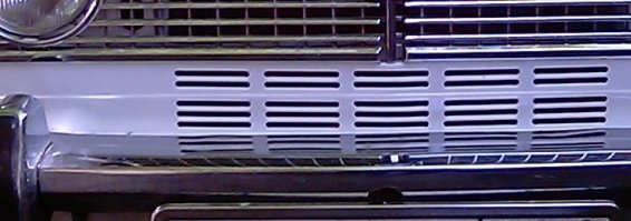 Задели две вещи:
- 2103 на первой фотке выпущена до 1975г. На машинах 1974..75 годов, под основной решёткой радиатора прямо в листе кузовщины вырублена маленькая решёточка, на более поздних машинах она расширена до двух сплошных вырезов перекачивавших потом в неизменном виде на 2106. Необходимость в этой решётке возникла из за проблем с поставками электродвигателя вентилятора охлаждения, а потом изменения просто не стали убирать посчитав что в любом случае они на пользу.  Часть автомобилей выпущенная в этот период укомплектована двигателем 2103 и вентилятором на валу помпы(как на 2101). Такое изменение предполагает не только другой диффузор вентилятора но и одну из кузовных деталей ("телевизор" в котором радиатор был наклонён чуть назад, опять же как на 2101) с другим партномером. Недостаточная производительность такого вентилятора и потребовала изменений. Были и 2103 с мотором 2101 для которых вентилятор на валу помпы был постоянным штатным решением.

- Сомнительным выглядит использование дискет для обновления управляющей программы в 1982 году. Во первых дискеты были ещё не очень распространены, во вторых технологические программисты не сильно жаловали магнитные носители в любом виде: ни магнитная лента ни дискеты не смогли вытеснить перфоленту. Станки с флопиками конечно встречаются но появились они сильно позже и флопики в них дохли бегом и живо. Фактически перфоленту смогли вытеснить только сетевые технологии и твердотельные носители (различные виды EEPROM картриджей)