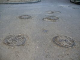 Для чего на люках в Оклахоме рисуют "точку"?