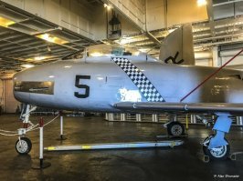 "FJ-2 Fury. Достаточно малоизвестный самолет. Было выпущено чуть более 700 шт. Если так можно сказать про самолет - ничем не примечательный. Внешне, чем-то на СУ-7 или МиГ-19 похож. "

В смысле ничем не примечательный? Fj-2 это попытка сделать из F-86 Сейбр палубную версию. А уж Сейбр очень даже примечательный. Главный антагонист наших Миг-15 в войне на Корейском полуострове (Корейской войне), по сути, единственный достойный соперник (разве это не примечательно?). Он внешне практически один-в-один (первая мысль, до того как прочитал подпись была, "о, Сейбр, а что он тут делает?"). 
Конкретно на этой фотке одно из отличий - пушечный модуль. У Сейбра он немного другой.  
Про Су-7 или миг-19 тут лишнее (особенно про Су-7, чем он там напоминает?). Лучше б написали, что это как из Су-27 сделали Су-33, чтоб понятнее людям было.