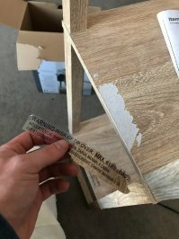 Эту этикетку и не надо было отрывать. Это предупреждающая надпись о том чтобы не превышали нагрузку на полку.